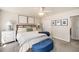 Bright bedroom featuring a comfortable king bed, soft carpet, and modern artwork at 3021 Favor Pines Sw Ct, Marietta, GA 30060