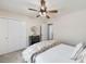 Cozy bedroom featuring a ceiling fan, closet, and patterned rug at 3021 Favor Pines Sw Ct, Marietta, GA 30060