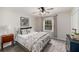 Cozy bedroom with a full-size bed, decorative pillows, and a vintage dresser at 3021 Favor Pines Sw Ct, Marietta, GA 30060