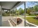 Covered front porch with a manicured lawn and landscape at 3021 Favor Pines Sw Ct, Marietta, GA 30060