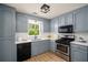 Modern kitchen with stainless steel appliances, updated counters, and ample cabinet space at 3021 Favor Pines Sw Ct, Marietta, GA 30060