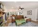Spacious living room featuring a stone fireplace, hardwood floors, and a dining area at 3021 Favor Pines Sw Ct, Marietta, GA 30060