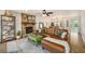 Spacious living room featuring a stone fireplace, hardwood floors, and a leather couch at 3021 Favor Pines Sw Ct, Marietta, GA 30060