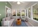 Bright sun room featuring large windows offering natural light and views of the property at 3021 Favor Pines Sw Ct, Marietta, GA 30060