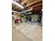 Unfinished basement with visible utilities and storage shelves, offering potential for customization at 684 N Cherokee N Rd, Social Circle, GA 30025