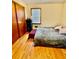 Bedroom with hardwood floors, full bed, and a closet at 684 N Cherokee N Rd, Social Circle, GA 30025