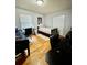 Bedroom featuring hardwood floors, a twin bed, desk, and natural light from a window at 684 N Cherokee N Rd, Social Circle, GA 30025