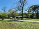 Spacious front yard and driveway, showcasing a single story house with ample space at 684 N Cherokee N Rd, Social Circle, GA 30025