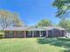 Charming brick home featuring a well-manicured front lawn and inviting facade at 684 N Cherokee N Rd, Social Circle, GA 30025