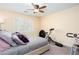 Cozy bedroom featuring a comfortable bed, plush pillows, and exercise equipment at 875 Edgewater Cir, Marietta, GA 30062