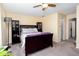 Bedroom with a large bed, carpeted floor, and windows for natural light at 875 Edgewater Cir, Marietta, GA 30062