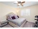 Cozy bedroom featuring a comfortable bed, plush pillows, and an exercise bike for convenience at 875 Edgewater Cir, Marietta, GA 30062