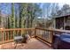 Wooden deck overlooking a serene pond, ideal for outdoor relaxation and entertaining at 875 Edgewater Cir, Marietta, GA 30062