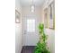 Bright entryway featuring decorative lighting, a white door, and stylish wall art at 875 Edgewater Cir, Marietta, GA 30062