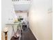 Hallway featuring a glass console table and a staircase that leads to another floor at 875 Edgewater Cir, Marietta, GA 30062