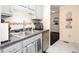Functional kitchen with ample counter space, stainless steel sink, and mosaic tile backsplash at 875 Edgewater Cir, Marietta, GA 30062