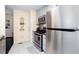 Cozy kitchen featuring stainless steel appliances and white tile flooring for a clean and modern look at 875 Edgewater Cir, Marietta, GA 30062