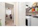 Convenient laundry area with washer, dryer, and shelving for organization and storage solutions at 875 Edgewater Cir, Marietta, GA 30062