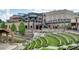 The Bowl at Sugar Hill's outdoor amphitheater with modern mixed-use brick buildings, park-like landscaping, and stage area at 1250 Ainsworth Aly # 42, Sugar Hill, GA 30518