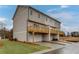New construction with balconies, ground garages, and landscaping at 1250 Ainsworth Aly # 42, Sugar Hill, GA 30518