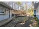 Enjoy the outdoors on the tiered wood patio and stone patio of this home's backyard at 2887 Swarthmore Dr, Lawrenceville, GA 30044