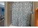 Shower with floral shower curtain and tiled wall in this bathroom at 2887 Swarthmore Dr, Lawrenceville, GA 30044
