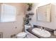 Charming half bath with dark granite countertops and decorative floating shelves at 2887 Swarthmore Dr, Lawrenceville, GA 30044