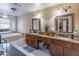 Bathroom featuring dual sinks and a jetted tub for ultimate relaxation at 2887 Swarthmore Dr, Lawrenceville, GA 30044