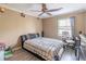 Cozy bedroom with modern furniture, including a large bed, desk, and dresser at 2887 Swarthmore Dr, Lawrenceville, GA 30044