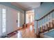 Inviting foyer with hardwood floors and staircase, leading into a bright and airy home at 2887 Swarthmore Dr, Lawrenceville, GA 30044
