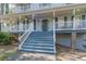 Charming home featuring a quaint front porch with stairs, columns, and traditional railings at 2887 Swarthmore Dr, Lawrenceville, GA 30044