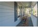 Cozy front porch with chairs, a small table, and a view of the neighborhood at 2887 Swarthmore Dr, Lawrenceville, GA 30044