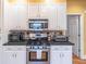 Stylish kitchen with stainless steel appliances and white cabinets, creating a modern and functional space at 2887 Swarthmore Dr, Lawrenceville, GA 30044