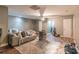 Spacious living room with wood floors, a ceiling fan and neutral-toned walls, with space for customization at 2887 Swarthmore Dr, Lawrenceville, GA 30044