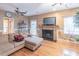 Inviting living room features a fireplace, hardwood floors, and ample natural light at 2887 Swarthmore Dr, Lawrenceville, GA 30044
