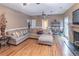 Spacious living room featuring hardwood floors, fireplace, and comfortable seating arrangement at 2887 Swarthmore Dr, Lawrenceville, GA 30044