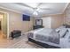 Spacious bedroom with updated flooring, modern furniture, and ensuite bathroom at 2887 Swarthmore Dr, Lawrenceville, GA 30044