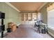 Home office with built-in bookshelves, neutral-colored walls, and carpeted floors at 2887 Swarthmore Dr, Lawrenceville, GA 30044