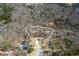 Aerial view of the property showing the lot lines, homes, and surrounding wooded area at 939 Jean Ct, Covington, GA 30014