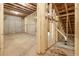 An unfinished basement with stud framing offers a blank canvas for customization at 939 Jean Ct, Covington, GA 30014