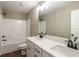 A bathroom with double sinks, black fixtures, and a shower/tub combo offers both style and functionality at 939 Jean Ct, Covington, GA 30014