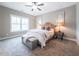 Bedroom with neutral walls, carpet, ceiling fan, and furnishings for staging at 939 Jean Ct, Covington, GA 30014