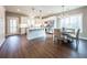 Bright kitchen and dining area featuring white cabinetry, stainless steel appliances, and modern fixtures at 939 Jean Ct, Covington, GA 30014