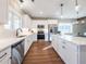Well-lit kitchen with white cabinetry, stainless steel appliances, and a large island countertop at 939 Jean Ct, Covington, GA 30014