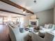 Inviting living room featuring a brick fireplace, wood beam, and comfortable seating area at 939 Jean Ct, Covington, GA 30014