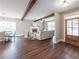Spacious living room with hardwood floors, a brick fireplace, and an inviting seating arrangement at 939 Jean Ct, Covington, GA 30014