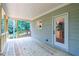 Spacious wooden porch with wooded views at 939 Jean Ct, Covington, GA 30014