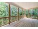 A spacious wooden deck overlooks a lush green forest, creating a serene outdoor retreat at 939 Jean Ct, Covington, GA 30014