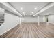 Expansive basement with recessed lighting, neutral walls, and durable flooring at 1590 Highland Farm Dr, Suwanee, GA 30024