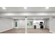 Open basement features a kitchenette area with stainless steel appliances at 1590 Highland Farm Dr, Suwanee, GA 30024